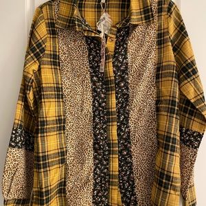 Long sleeve, Button down, multi- patterned shirt.